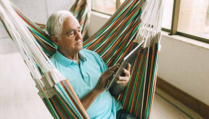 older-man-reading-window